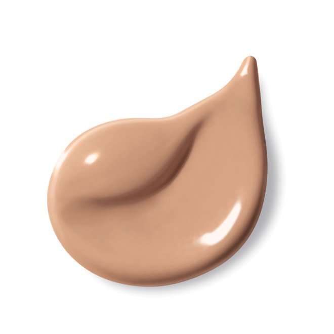 Gros plan sur une goutte de fond de teint liquide à la texture lisse.