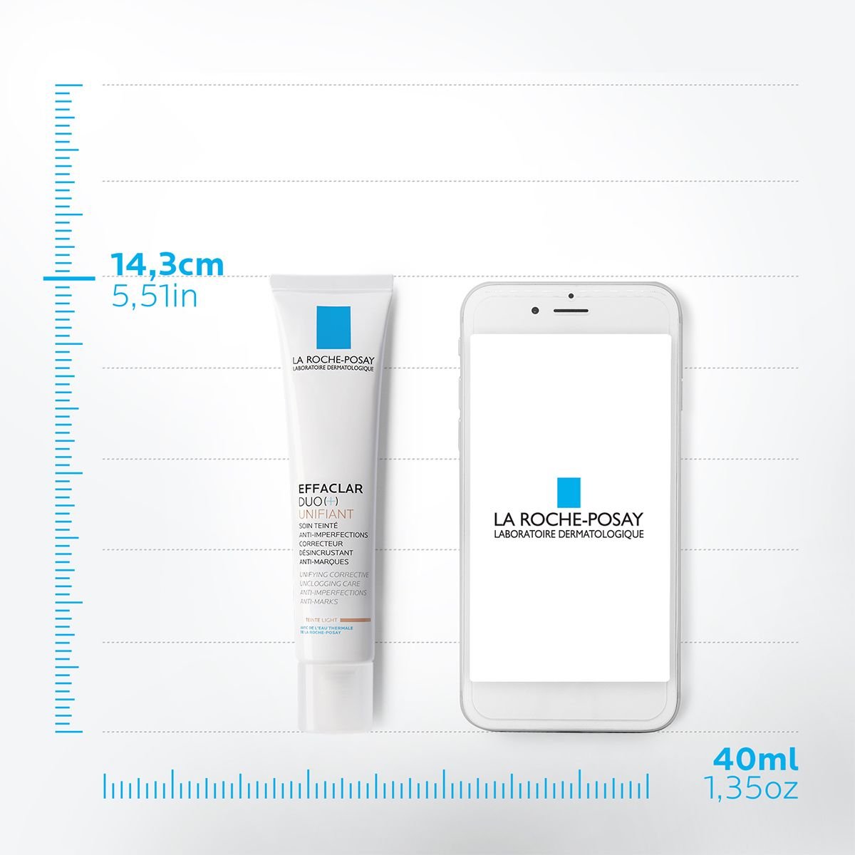 Produit de soin pour la peau La Roche-Posay Effaclar Duo plus Unifiant dans un tube de 40 ml à côté d'un smartphone, avec des dimensions de 14,3 cm (5,51 pouces) de hauteur et une contenance de 40 ml (1,35 once).